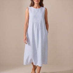 The Adele striped midi dress, walking view showing the relaxed fit and side pocket