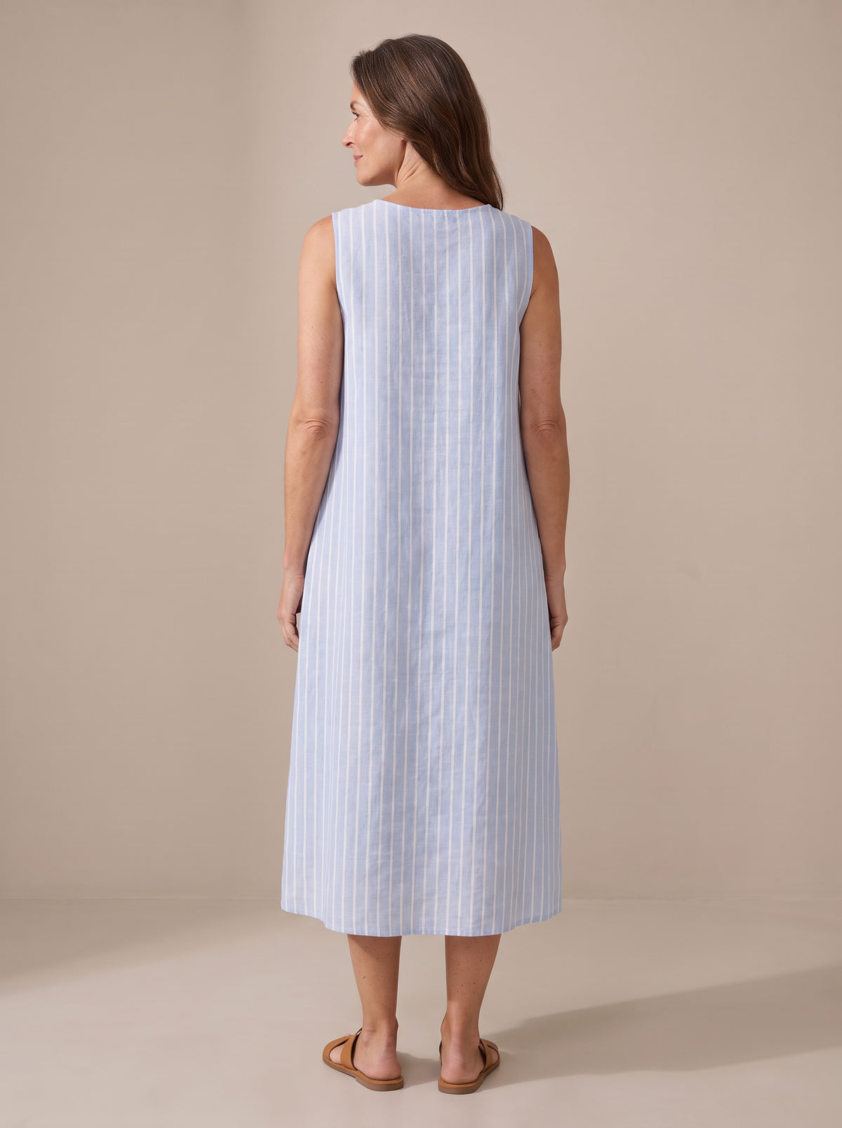 The Adele blue and white striped midi dress, back view with mid-calf length