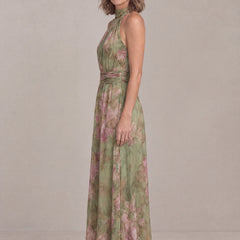 Liora floral halter maxi dress, side view showing the maxi length and gathered waistband