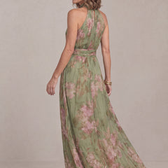Liora halter maxi dress in sage green floral chiffon, back three-quarter view of the flowing skirt