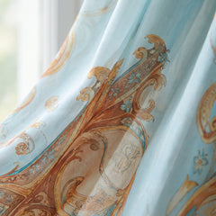 Close-up of the baroque print fabric in sky blue, terracotta and gold