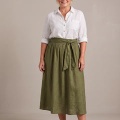 Rosalind set in white shirt and olive skirt