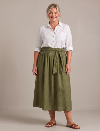 Rosalind set in white shirt and olive skirt