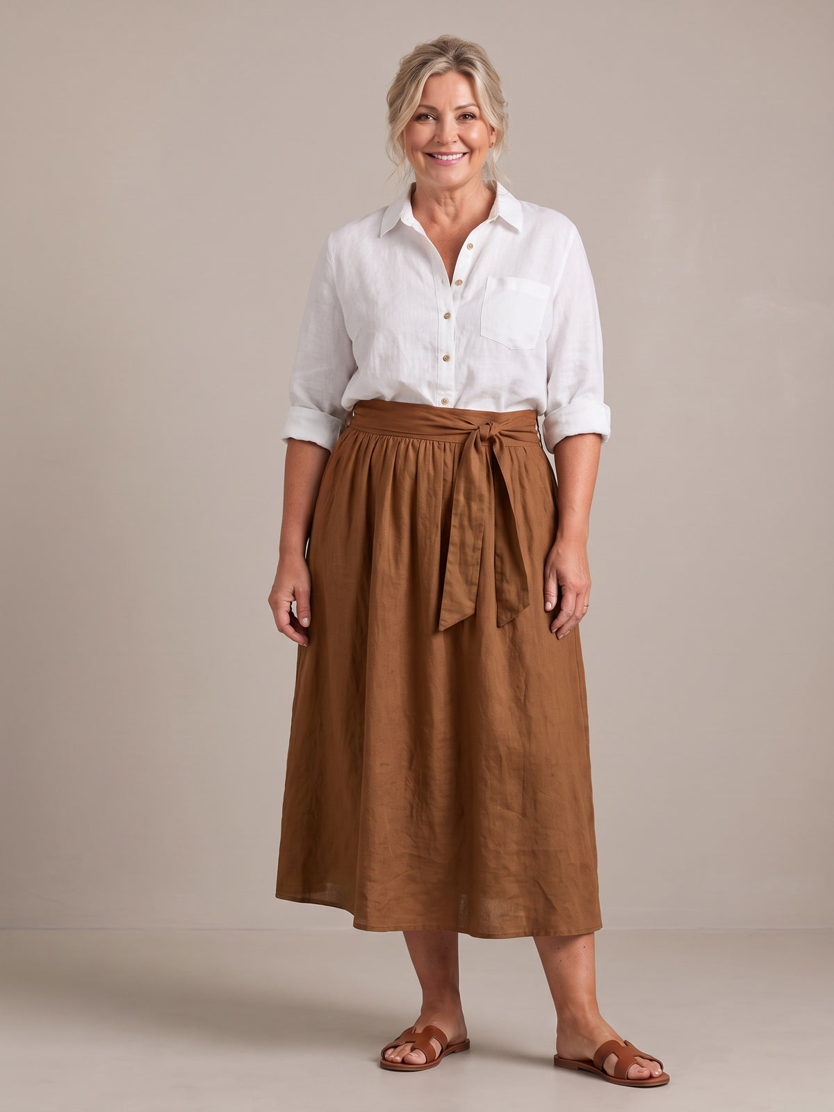 Rosalind set in white shirt and brown skirt