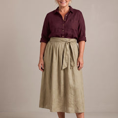 Rosalind set in burgundy shirt and sand skirt