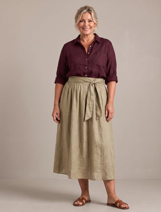 Rosalind set in burgundy shirt and sand skirt