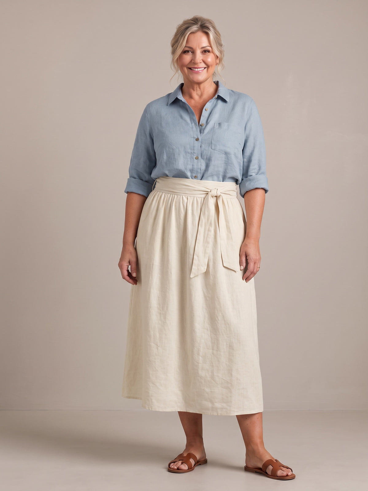Rosalind set in light blue shirt and cream skirt